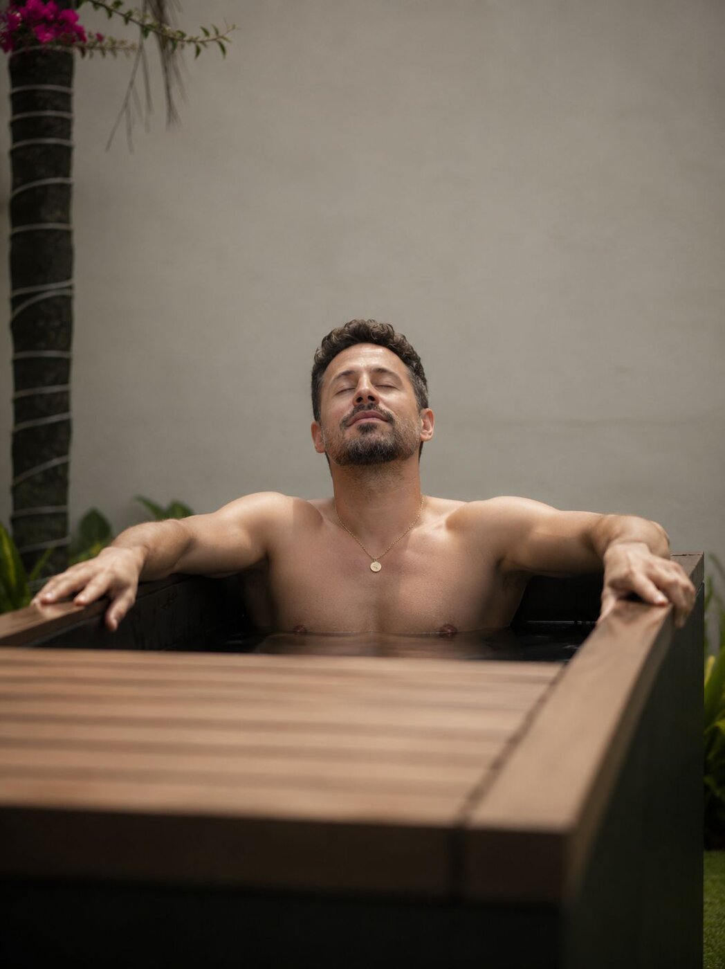 Guest resetting in the cold plunge at Tempo Studio